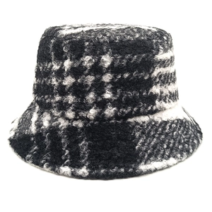 Classic black and white checkered teddy fleece bucket hat with textured warm fabric