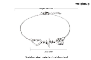 Detail of silver stainless steel heart and cat paw charm bracelet with lobster clasp