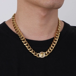 Close-up of 13mm gold Cuban link chain with iced-out CNC diamond buckle on male neck