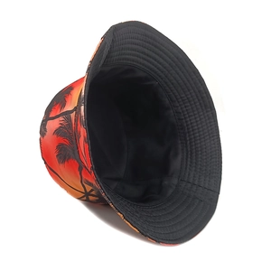 Detail of tropical sunset coconut tree pattern bucket hat with black inner lining