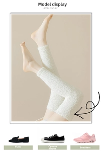 Detail of white coral fleece leg warmers with soft plush texture for winter comfort