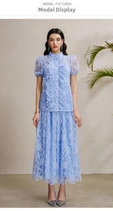 Close-up of light blue lace fabric texture with delicate ruffles on a resort wear set