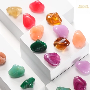 Macro detail of multicolor irregular resin beads with marbled textures for DIY crafts