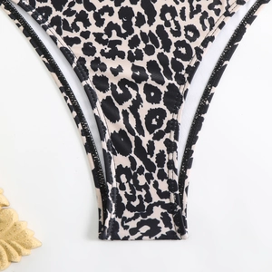 Detail of high-elastic leopard print bikini bottom with flat black seam stitching