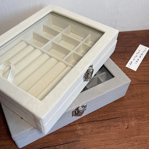 Macro detail of velvet jewelry box with transparent window and metal lock storage