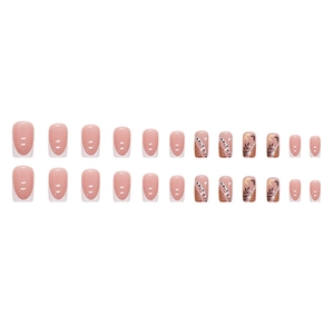 French tip press-on nails with white glitter and leaf silhouette patterns in square shape