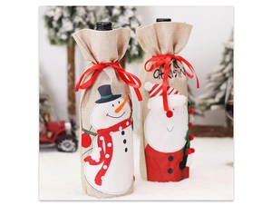Detail of burlap Christmas wine bottle covers featuring Santa and Snowman with red ribbons