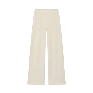 Detail view of cream high-waisted wide-leg trousers showing smooth fabric and crisp center crease