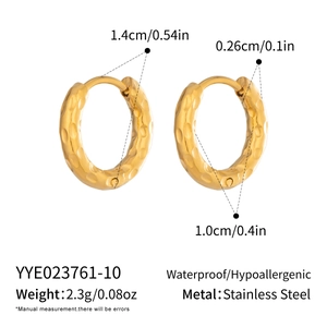 Macro view of 18K gold plated stainless steel hoop earrings with hammered texture detail