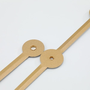 Golden aluminum clock hands for quartz watches with brushed finish on white background