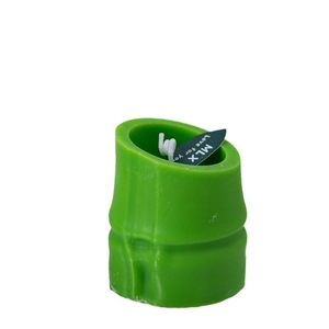 Bamboo shaped green scented candle with MLX decorative tag on a plain white background