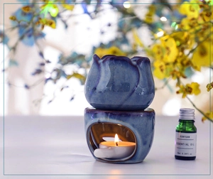 Blue glazed ceramic tulip oil burner set with carved base and white candle holder