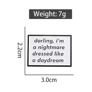 Minimalist enamel lapel pin with lyrics engraving, rectangular black and white badge