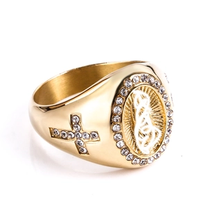 Detail of gold religious ring featuring saint icon relief and CZ crystal cross inlay