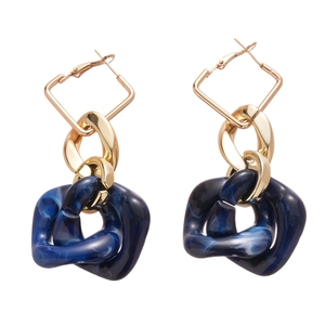 Geometric acrylic drop earrings with dark blue marble pattern and gold metal finish