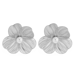 Detail of silver ginkgo leaf flower earrings with a white pearl center and fine textures