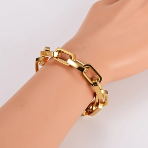 Minimalist golden stainless steel bamboo link chain bracelet on model wrist with polished finish