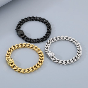 Detailed view of silver, gold and black Cuban link bracelets with magnetic clasps for men