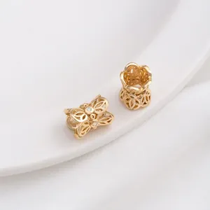 Macro shot of 14K gold plated hollow floral spacer beads with sparkling zircon stones