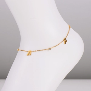 Gold music note anklet with clear crystal pendant on foot model for beach fashion