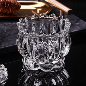 Modern minimalist lotus-shaped clear glass storage jar with embossed floral patterns