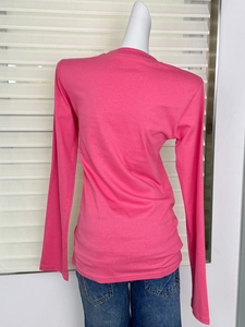 Detail view of pink long-sleeve crewneck cotton t-shirt back on a mannequin torso
