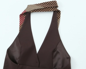 Detail of dark brown halter top with vintage geometric diamond pattern neck strap