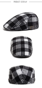 Three-view display of black and white plaid wool flat cap with metal side buckles