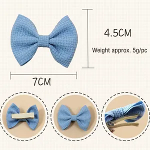 Blue waffle texture bow hair clip for children, size 7cm x 4.5cm, with metal back clip