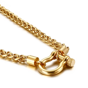 Golden wheat chain necklace with U-shaped horseshoe shackle clasp in industrial style