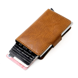 Detail of brown lychee leather RFID blocking card holder with pop-up aluminum wallet case