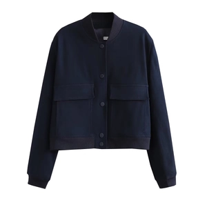 Detail of navy blue cropped utility jacket with ribbed collar and flap pockets