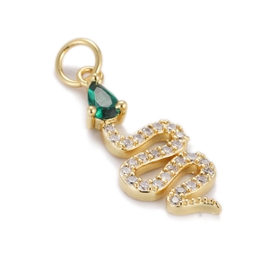 Exquisite gold snake pendant detail with green teardrop gem and pavé white cubic zirconia
