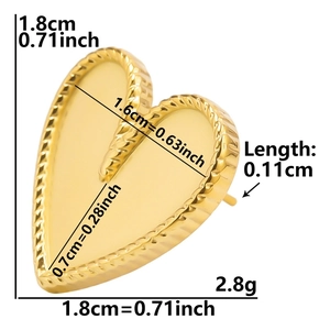 Detailed view of heart-shaped gold earring with 1.8cm diameter and twisted edge detail