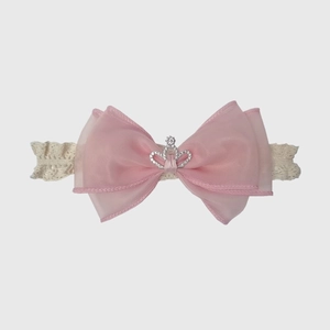 Detail of pink tulle bow baby headband with sparkling silver rhinestone crown on lace strap
