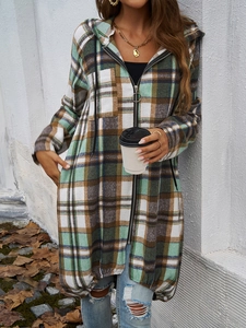 Detail of a casual plaid hooded jacket with zipper and drawstrings in autumn setting