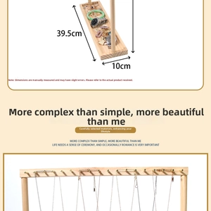 Detail view of wooden jewelry display stand with dimensions and hanging necklace hooks