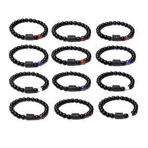 Twelve constellations obsidian and tiger eye stone stretch bracelet set on white background