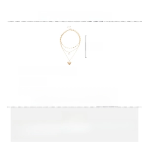 Detailed specs of triple-layer gold necklace with heart pendant and white pearls