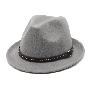 Detailed macro view of the grey wool felt fedora with gold and silver studded band