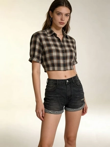 Slim fit black ripped denim shorts paired with a brown plaid cropped shirt set