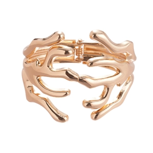 Exaggerated metal coral branch open bangle with polished gold finish and layered design