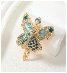 Elegant gold fairy brooch with blue cat eye stones and sparkling crystal rhinestones