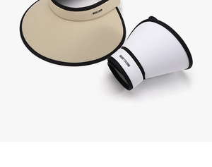 Detailed view of breathable mesh sun visors in beige and white with black trim