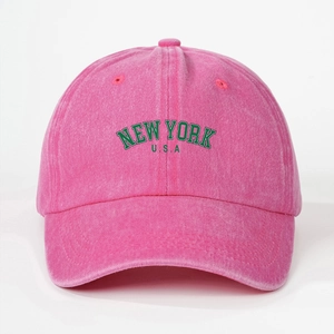 Detail of New York USA embroidery on pink washed cotton baseball cap with green borders
