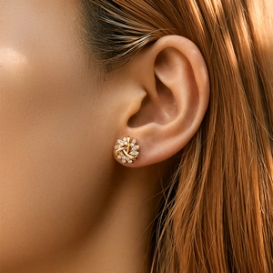 Exquisite 18K gold plated snowflake stud earrings with white zircon on ear model