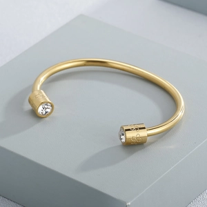 Minimalist gold cylindrical open cuff bracelet with white zircon and flower engraving