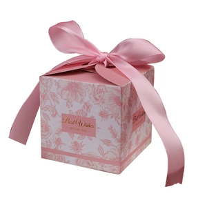 Pink floral wedding favor box with a satin ribbon bow and gold Best Wishes lettering