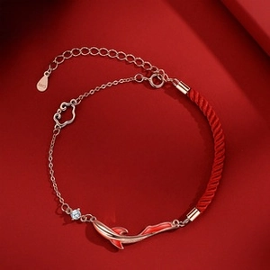 Close-up of S925 sterling silver koi fish bracelet with red woven rope and metal chain