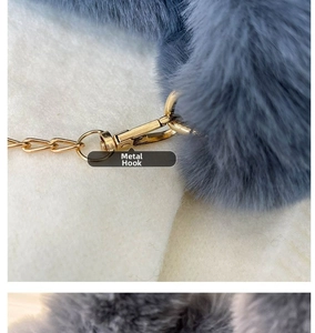 Detail of the high-density gold metal hook and spring clasp on blue faux fur tote bag